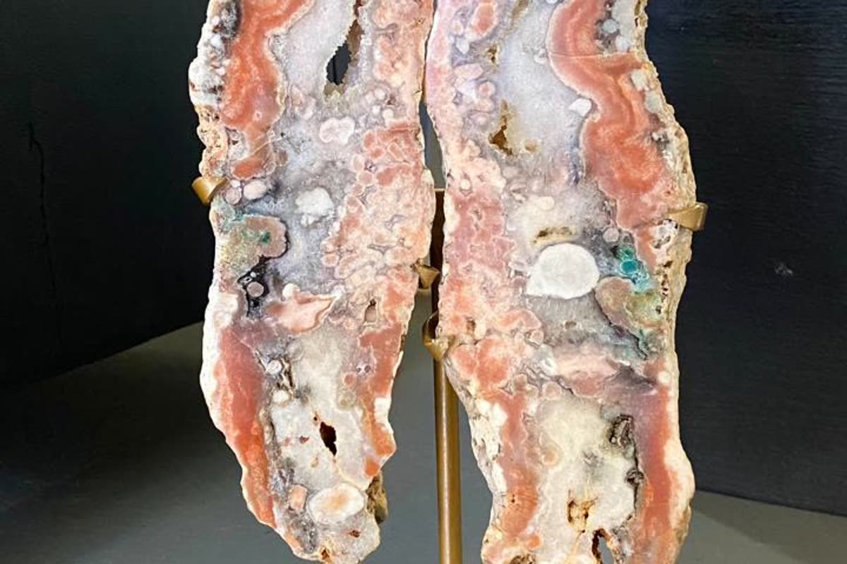Matched pair of pink agate geode halves mounted as wings on a gold stand: a unique piece you price against comparables to sell