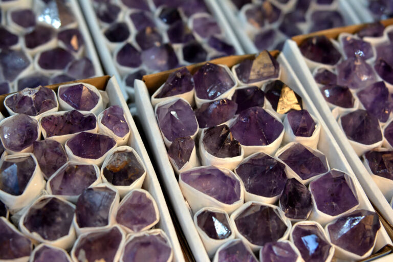 Rows of Brazilian amethyst geodes packed into wooden crates and prepared for export