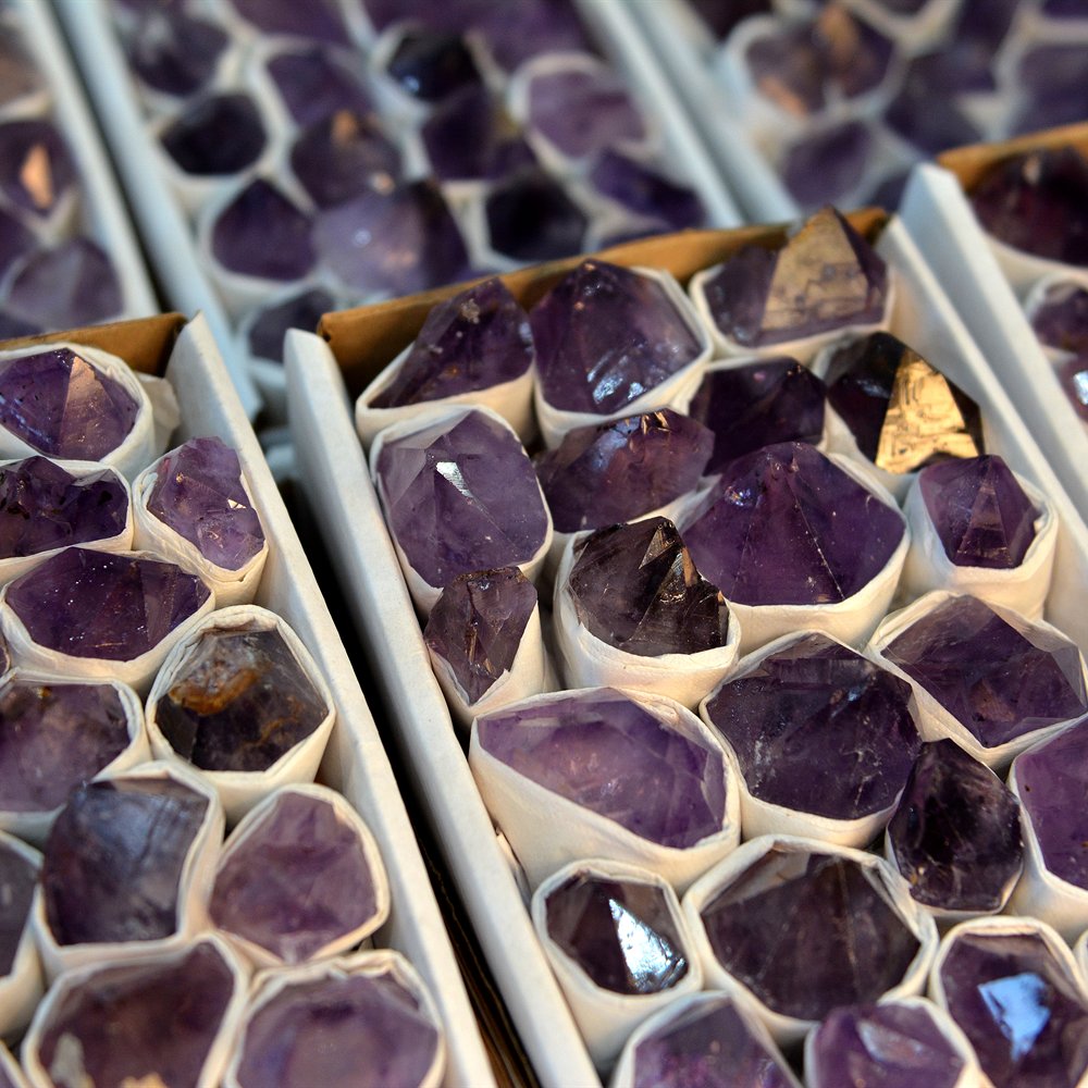 Trays of sorted Brazilian amethyst druzy pieces ready for wholesale
