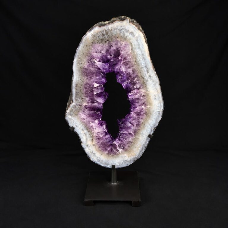 Amethyst geode slice with a white agate ring and an open centre, mounted on a metal stand